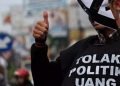 Politik Uang: Ancaman Demokrasi dan Kesejahteraan Rakyat (Editorial)